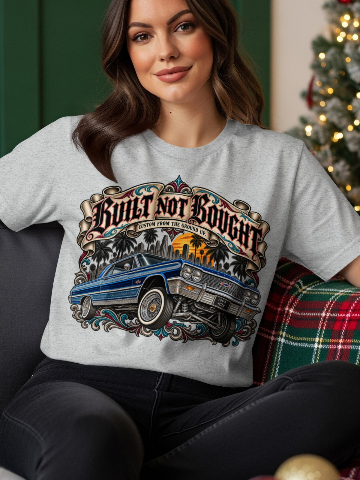 Grey t-shirt with "Built Not Bought" text and vintage blue lowrider car graphic.