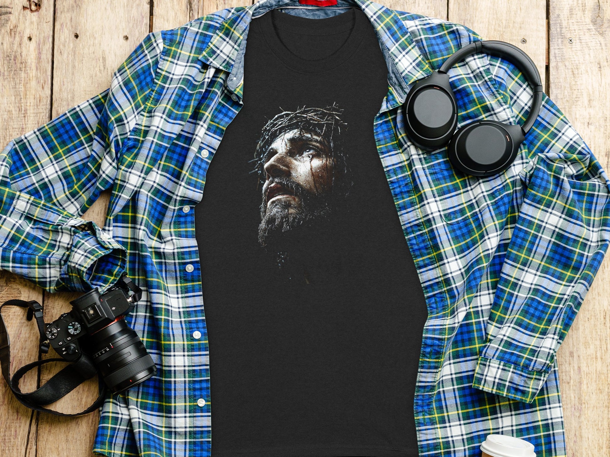 Black t-shirt with a depiction of Jesus Christ wearing a crown of thorns.