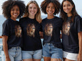 Four women wearing t-shirts with a split lion face design.