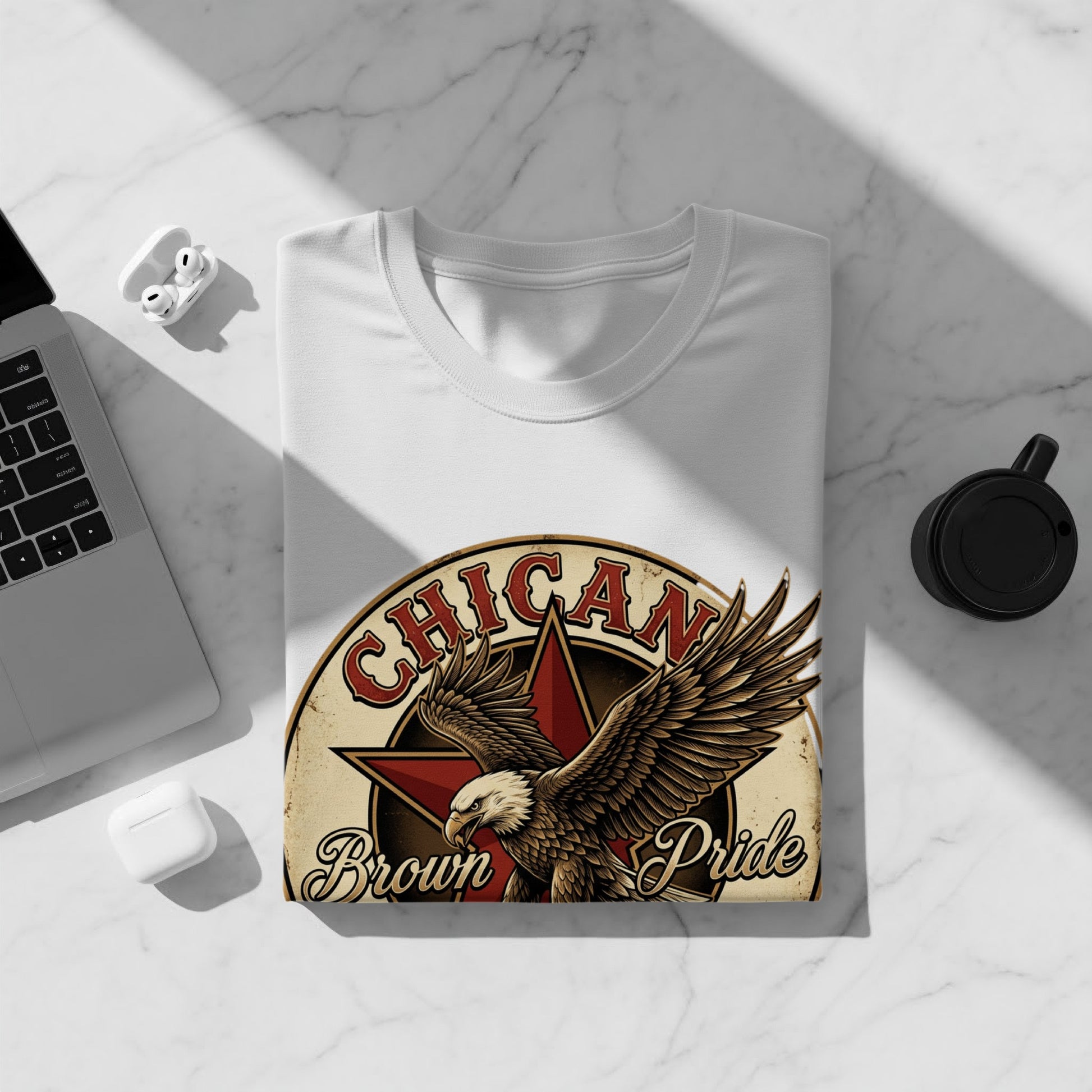White t-shirt featuring a Chican Pride eagle graphic with vintage distressed look.