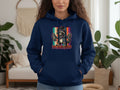 Navy hoodie featuring a raccoon wearing sunglasses and a bandana, holding spray paint cans.