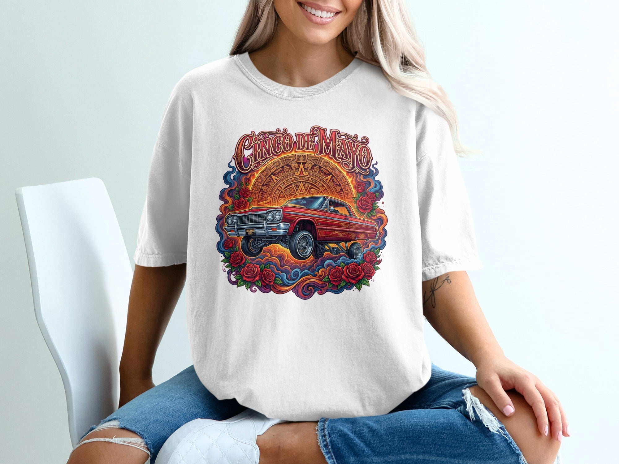 Cinco de Mayo graphic tee with classic red lowrider surrounded by roses.