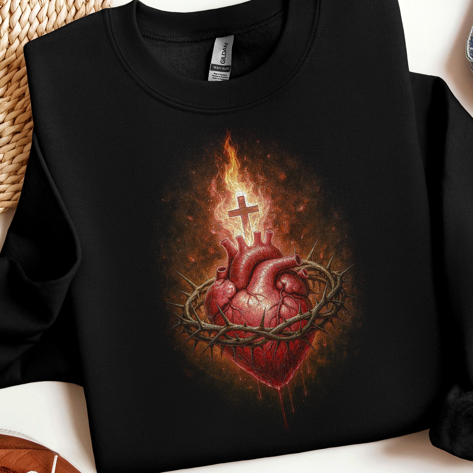 Black sweatshirt with Sacred Heart of Jesus emblem.