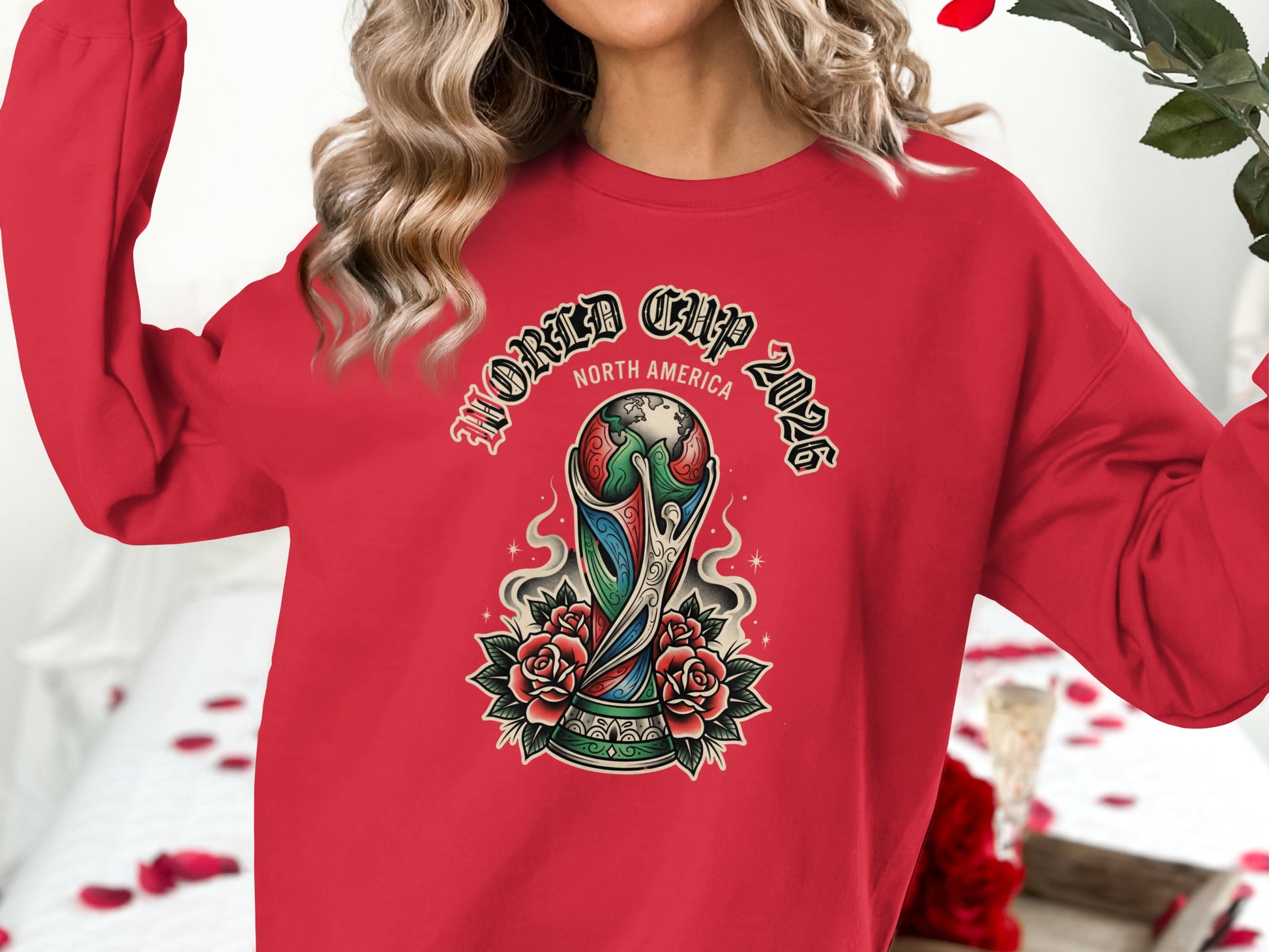 Red sweatshirt with "World Cup 2026 North America" text and trophy graphic.