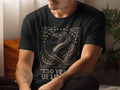 Black t-shirt with coiled snake and American flag, reading 