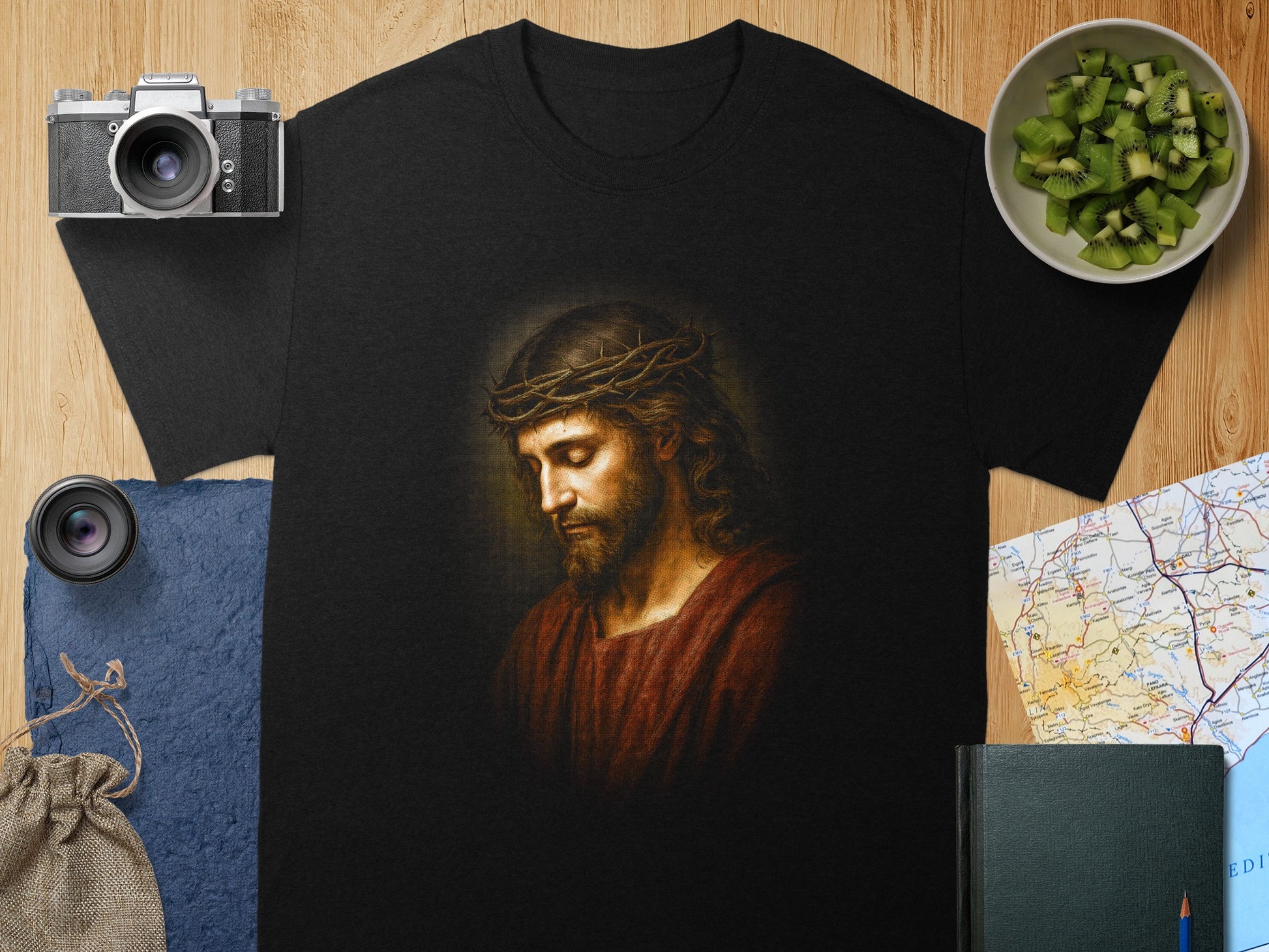 T-shirt featuring a painting of Jesus with a crown of thorns.