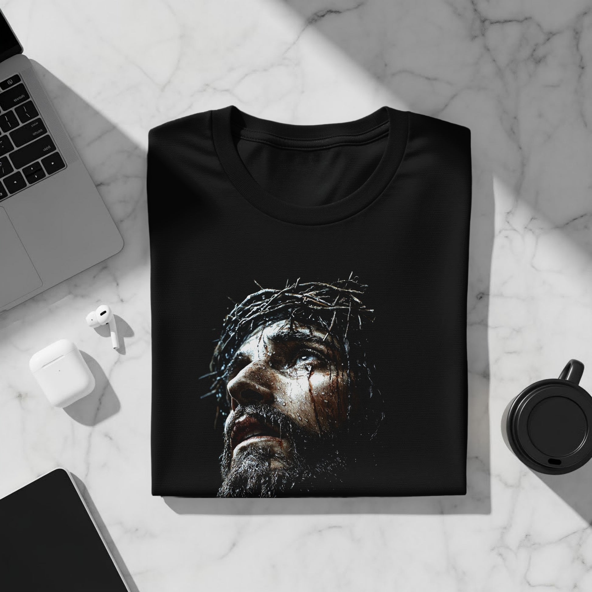 Black t-shirt with close-up of Jesus wearing a crown of thorns.