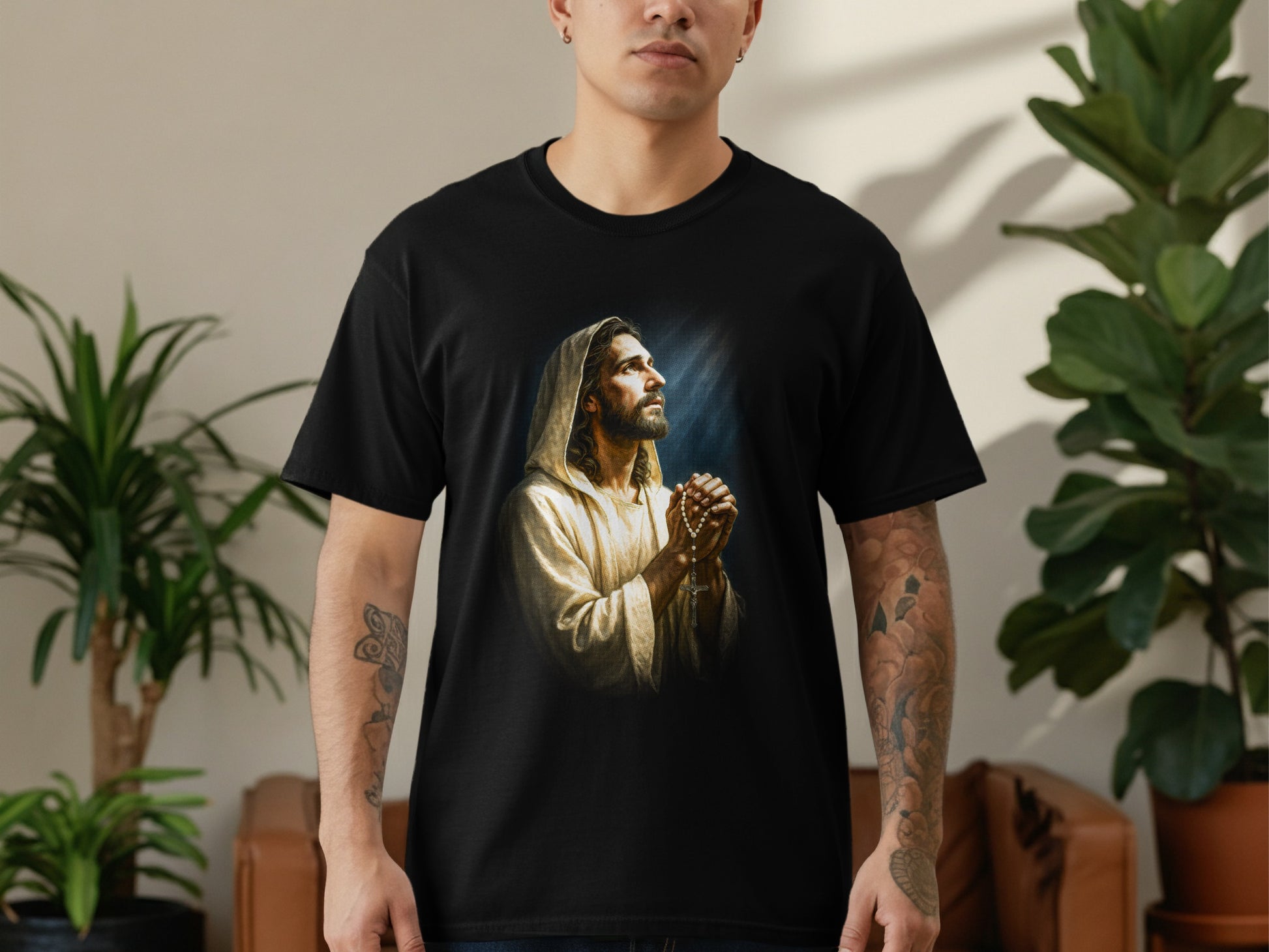 Black t-shirt featuring a painterly depiction of Jesus praying.