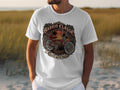 White t-shirt with circular graphic of a red lowrider bicycle, palm trees, and text.