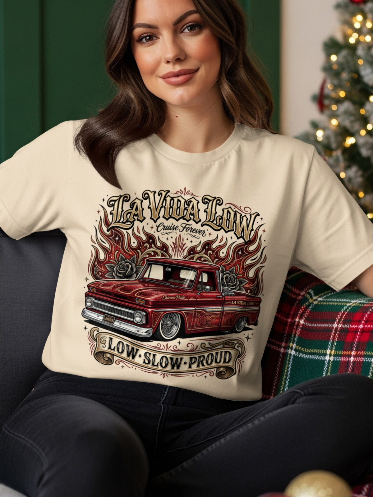 Cream t-shirt with "La Vida Low" text and a red lowrider truck with flames.