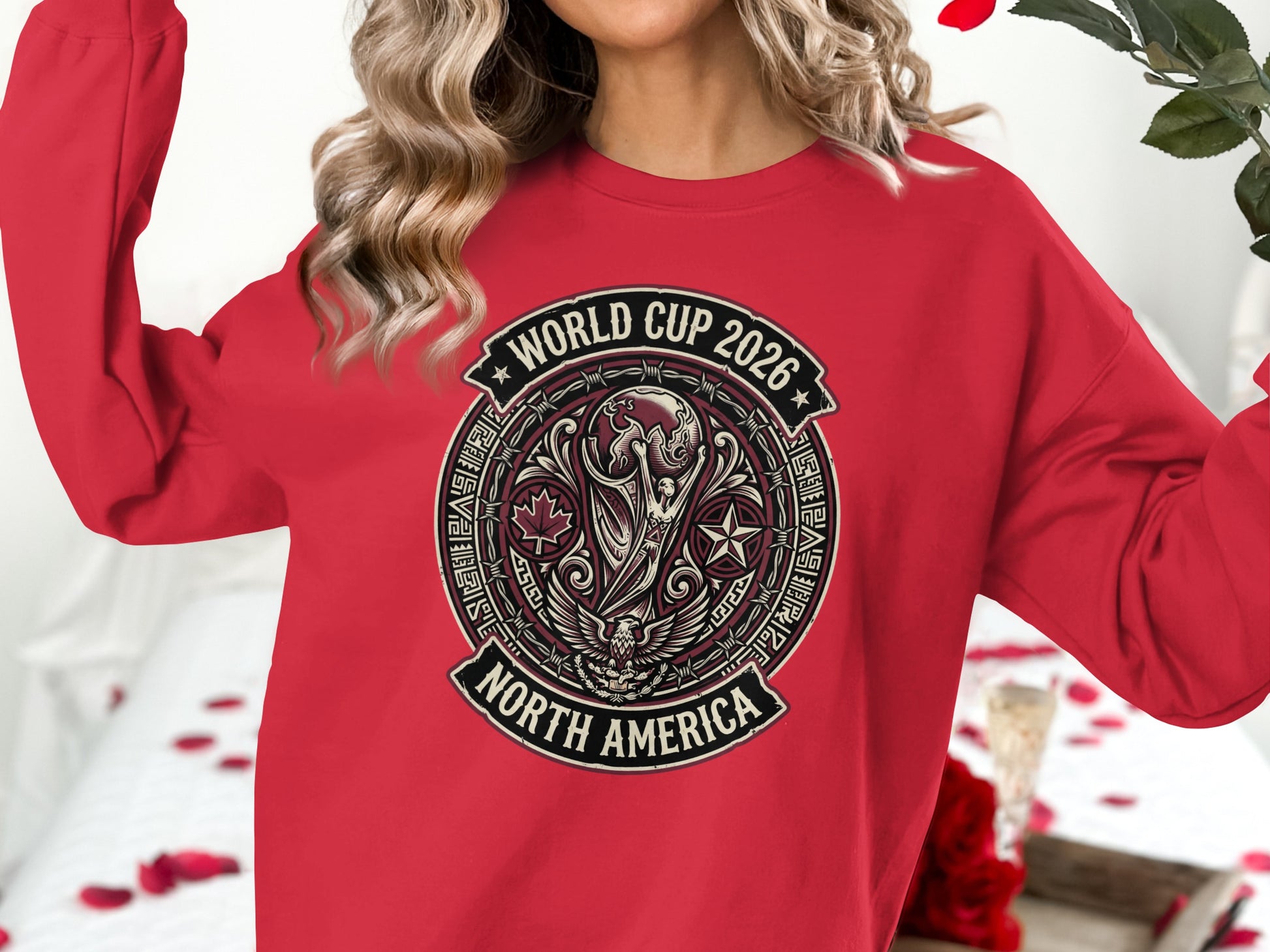 Red sweatshirt with "World Cup 2026 North America" circular emblem.