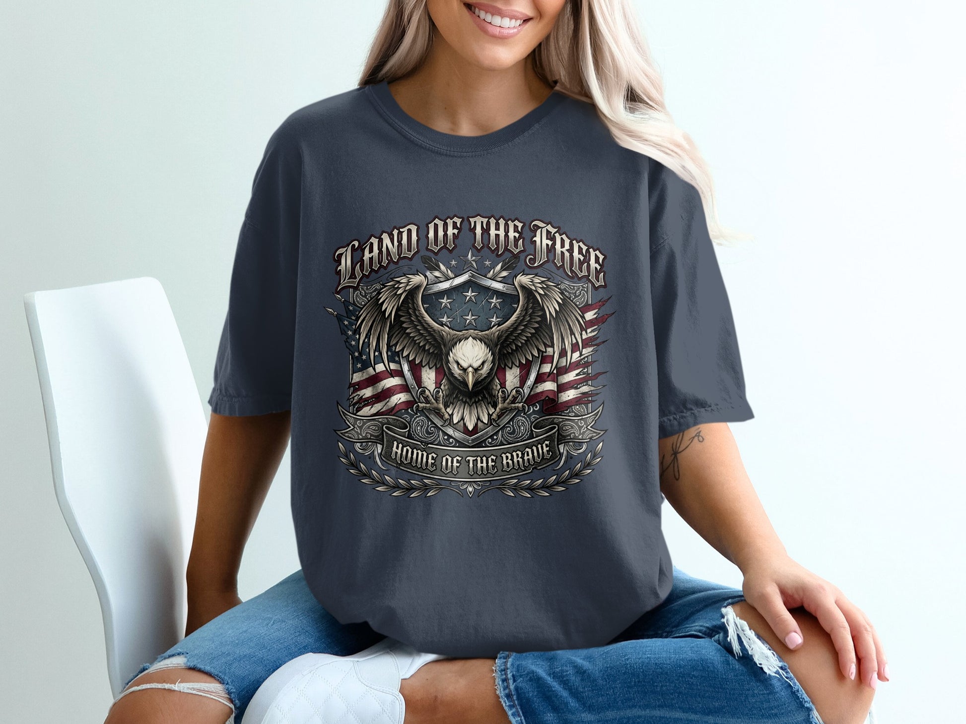 Dark grey t-shirt with eagle, flag, and "Land of the Free" text.