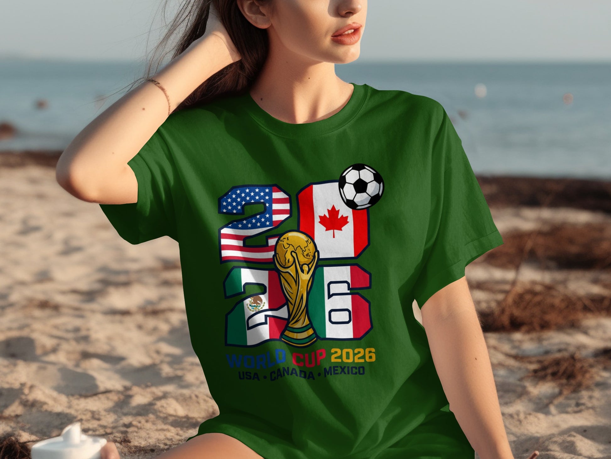 Green t-shirt with World Cup 2026 USA, Canada, Mexico flags and trophy.