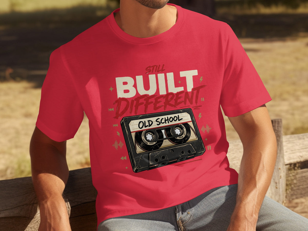 Red t-shirt with "Still Built Different Old School" cassette tape graphic.