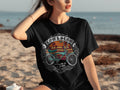 Black t-shirt with vintage bicycle graphic and text 
