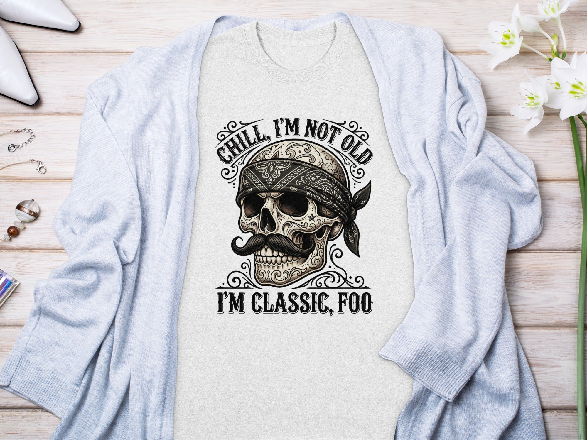 Skull wearing bandana and mustache, "Chill, I'm not old" and "I'm classic, foo" text.
