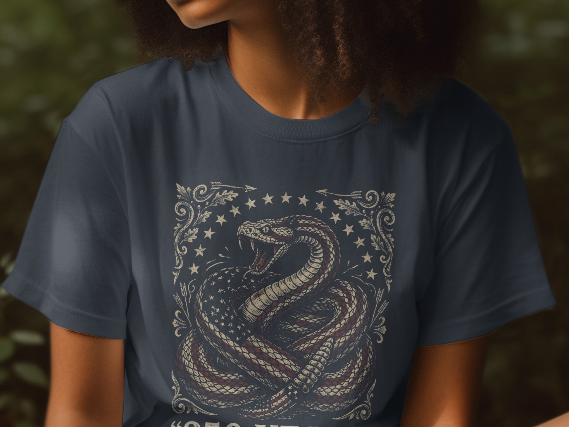 T-shirt with coiled rattlesnake wrapped in American flag, "Don't Tread On Me" text.