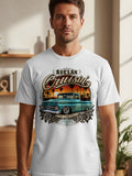 White t-shirt graphic with vintage teal truck, palm trees, sunset, and 