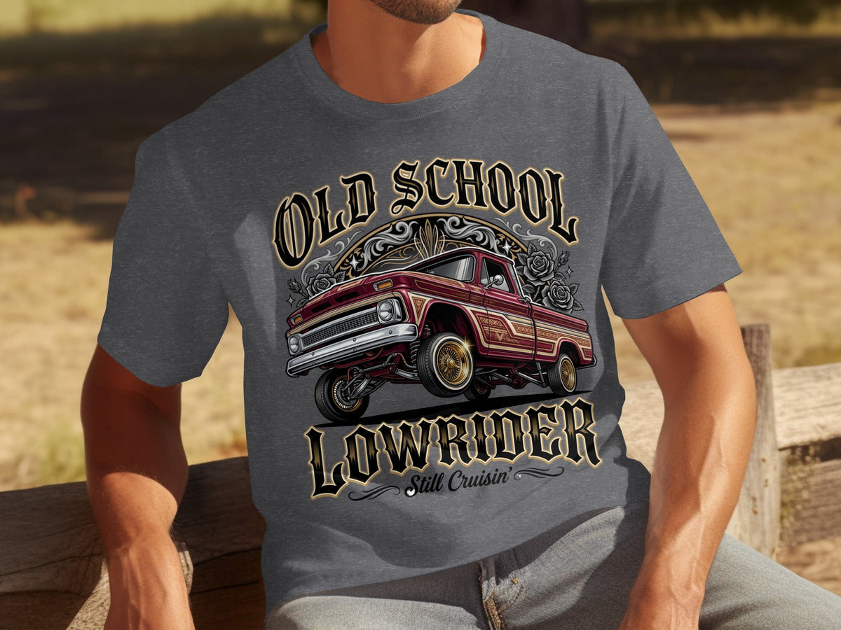 T-shirt graphic with a maroon lowrider truck and text "Old School Lowrider Still Cruisin'".