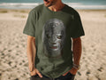 Green t-shirt with a detailed Mexican lucha libre mask graphic.