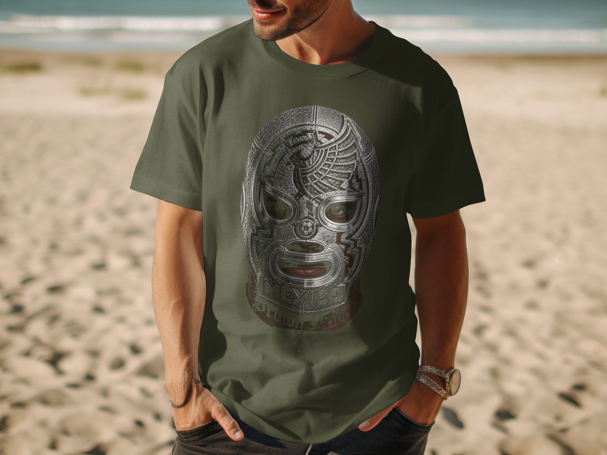 Green t-shirt with a detailed Mexican lucha libre mask graphic.