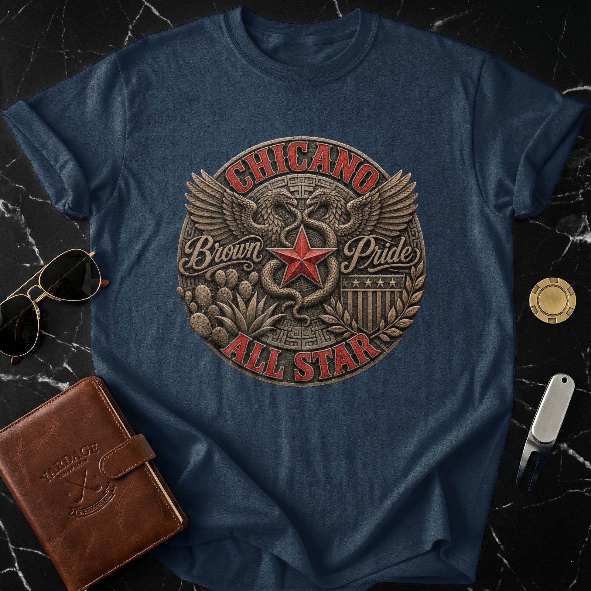 Navy t-shirt with "Chicano Pride All Star" circular emblem featuring a star and wings.
