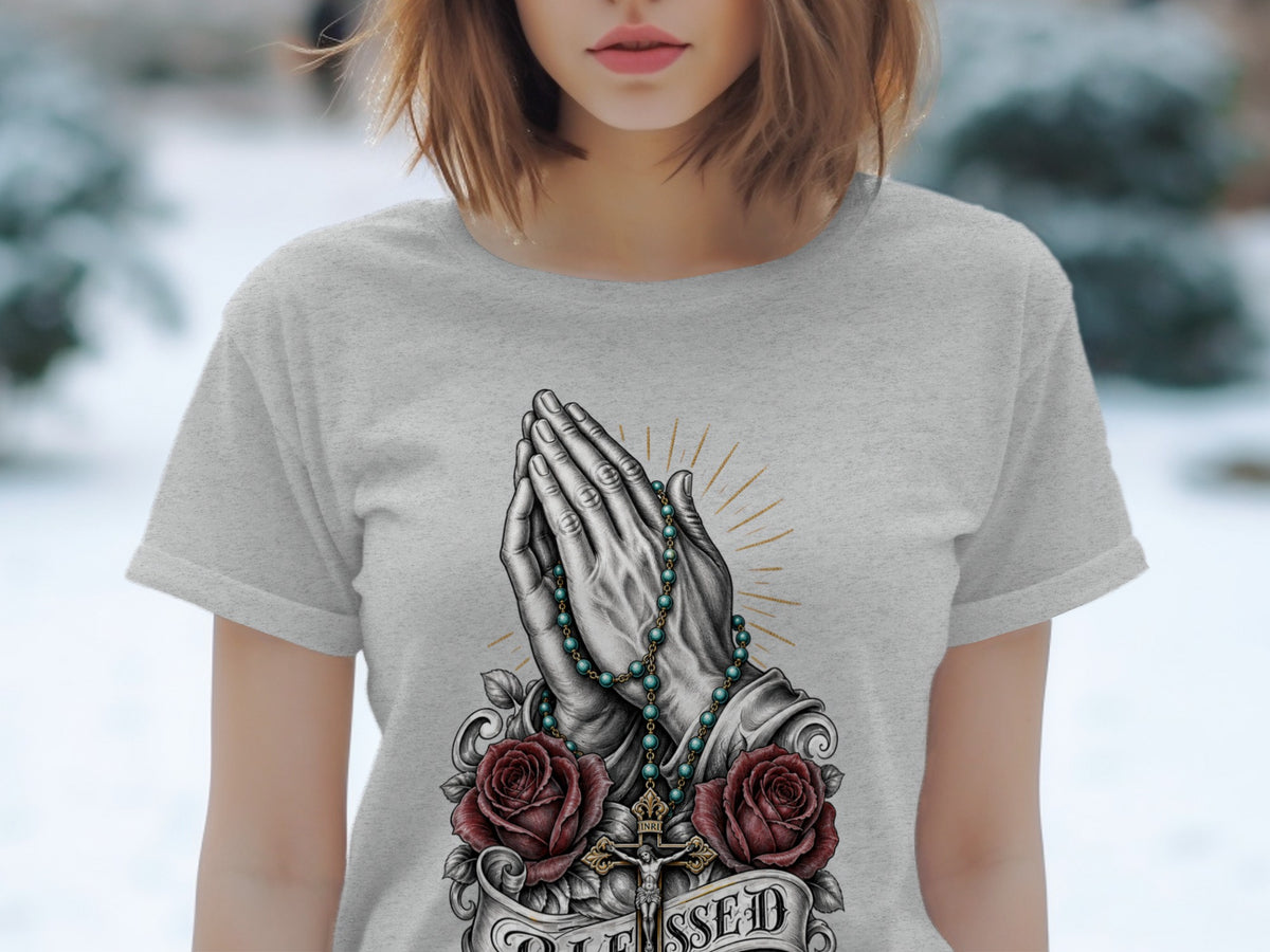 Gray t-shirt with praying hands, rosary, roses, crucifix, and "Blessed" text.