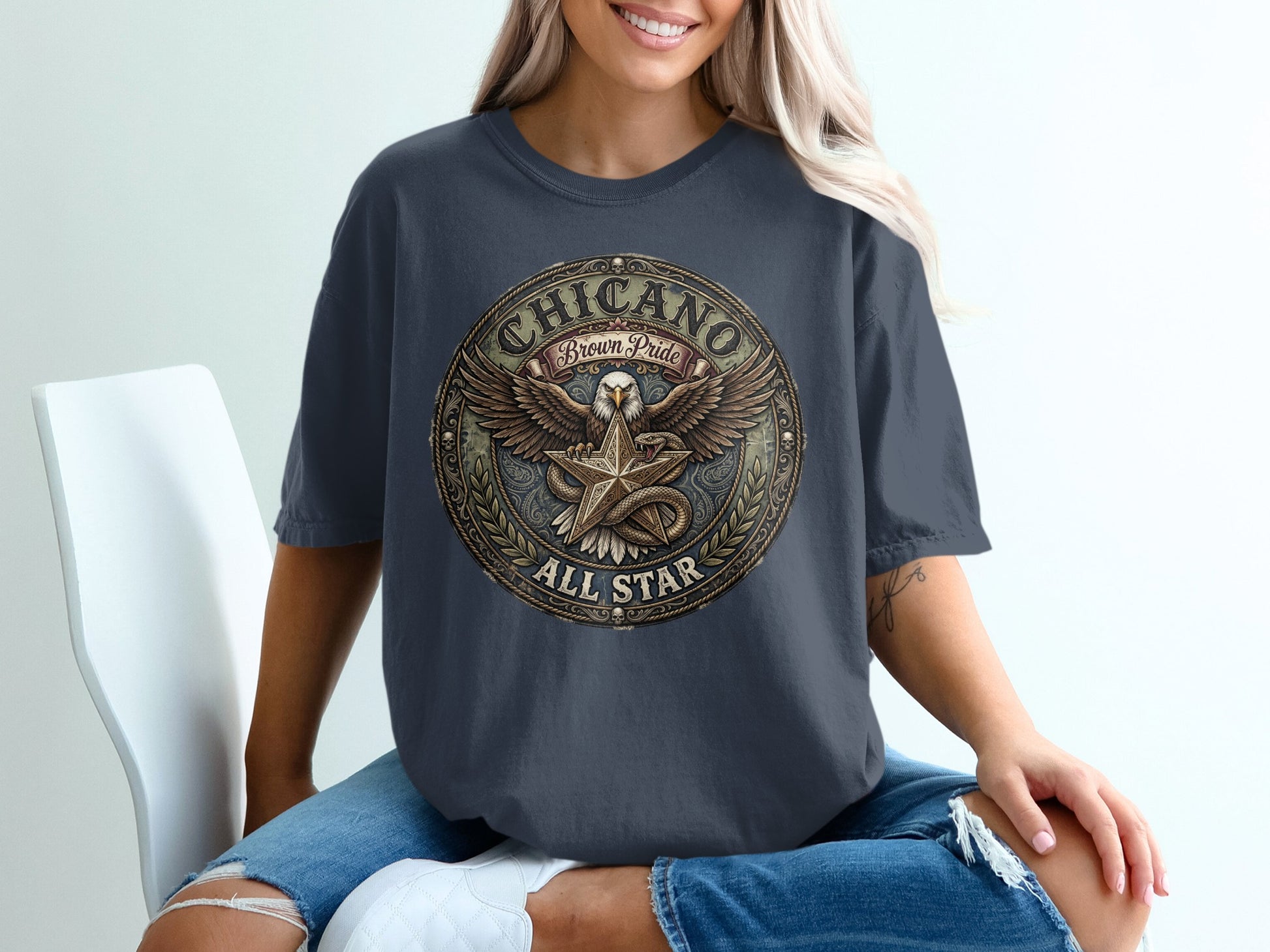 Dark t-shirt with round "Chicano Brown Pride All Star" emblem featuring eagle.