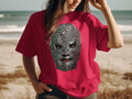 Red t-shirt with a metallic wrestling mask featuring a Mexican flag motif.