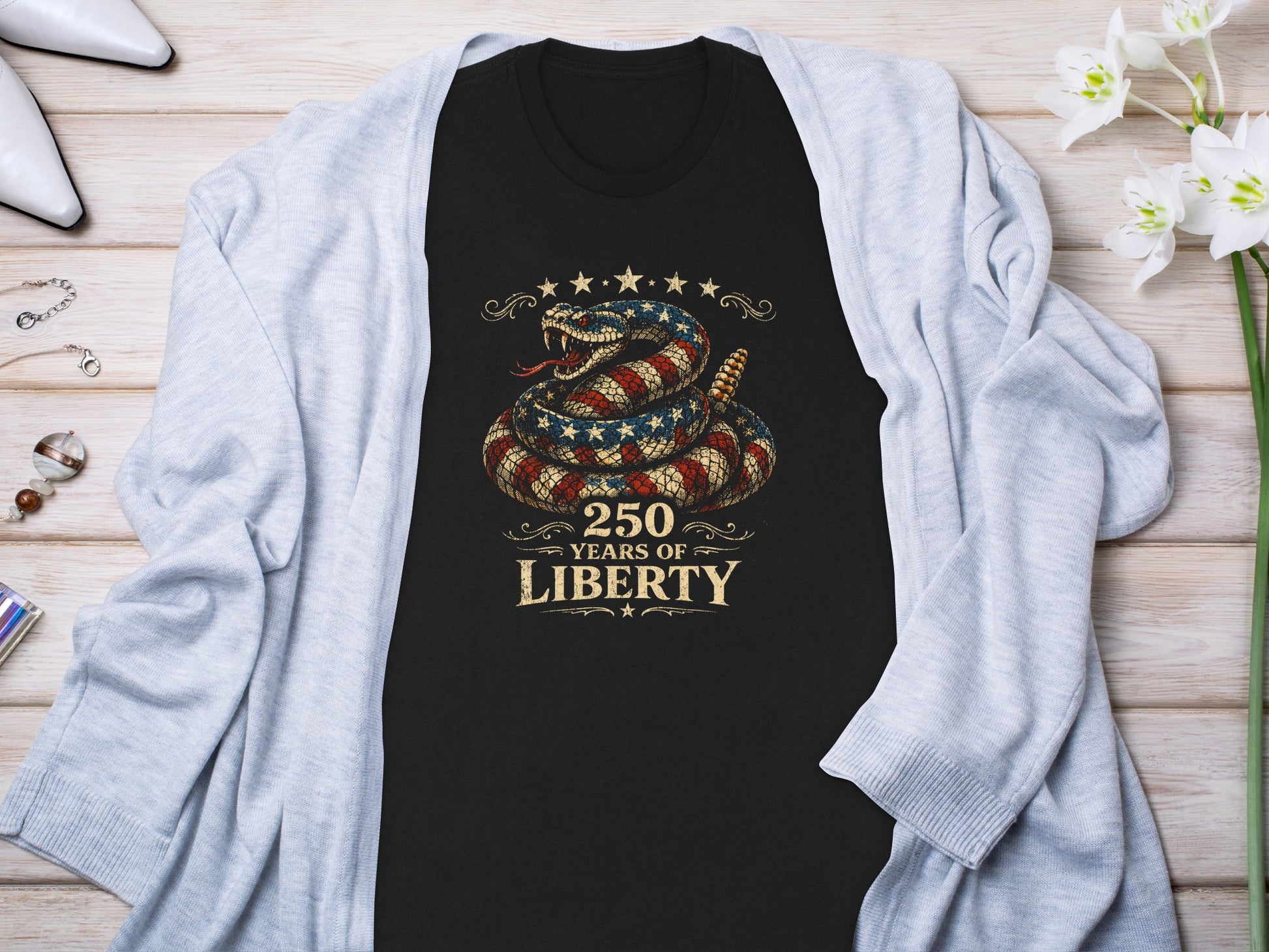 Black t-shirt with coiled rattlesnake, American flag, and "250 Years of Liberty".