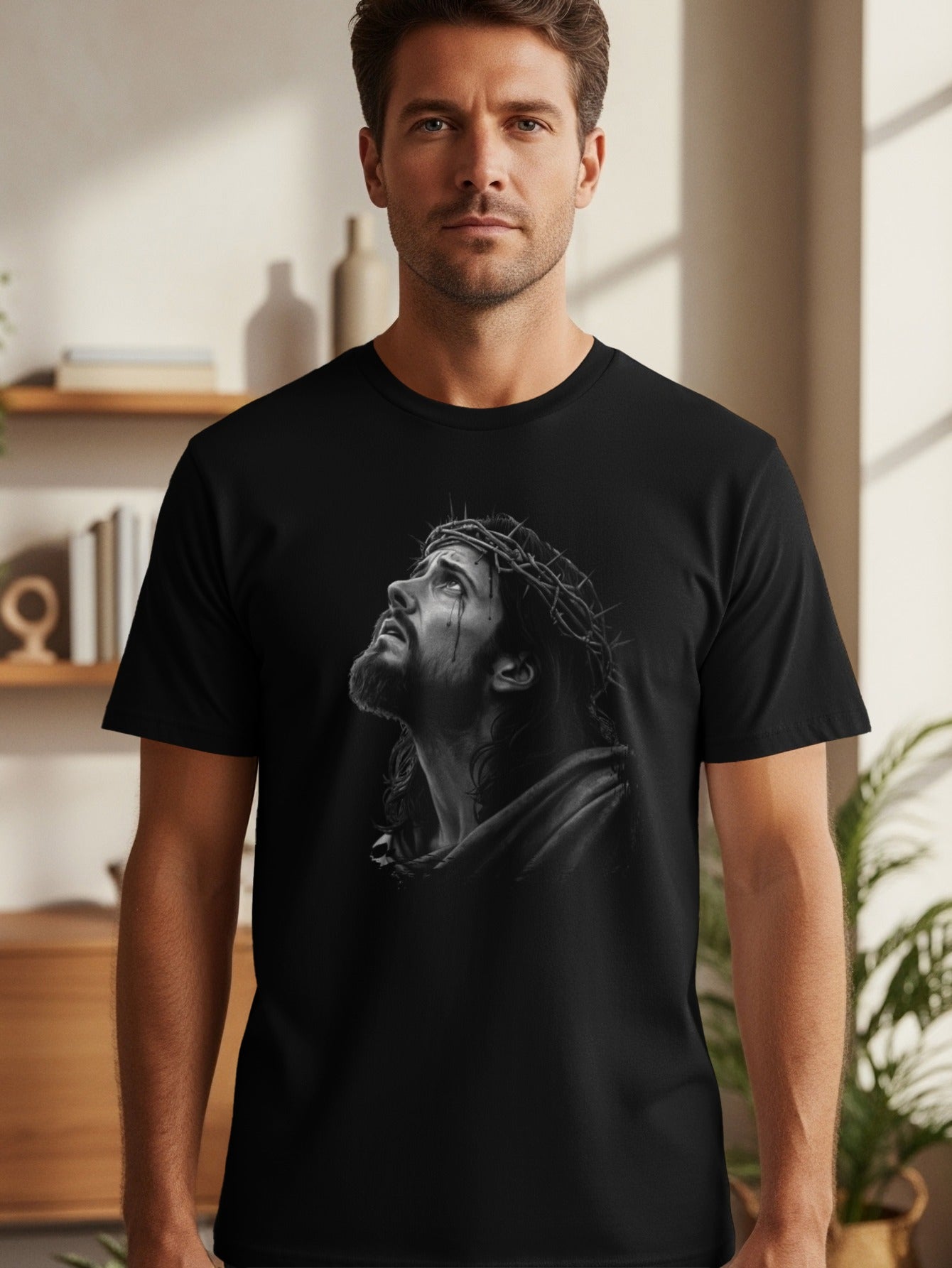 Black t-shirt with a grayscale illustration of Jesus wearing a crown of thorns.