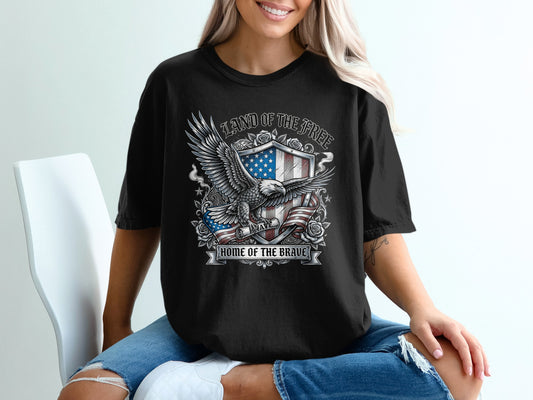 Black t-shirt with eagle, American flag, and "Land of the Free Home of the Brave" text.
