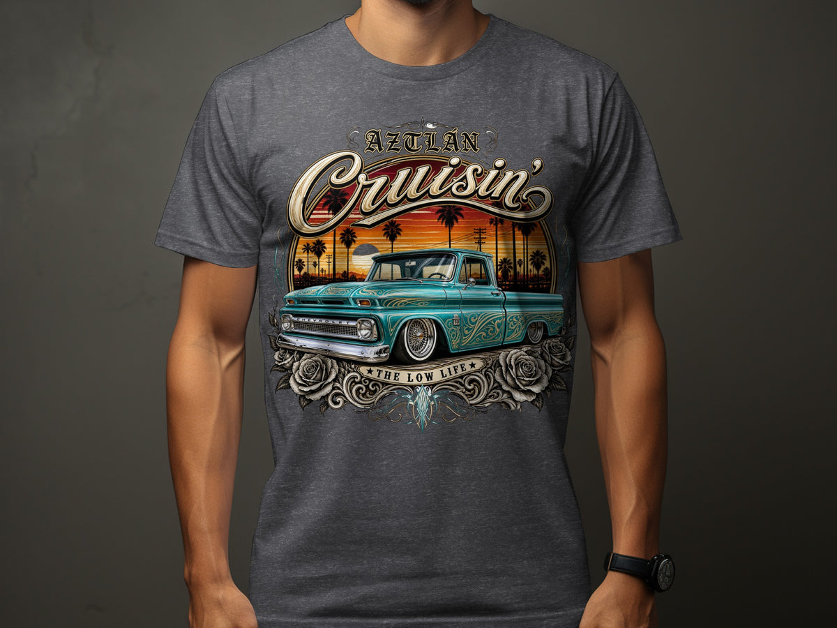 Turquoise classic pickup truck with "Aztlan Cruisin' The Low Life" text and roses.