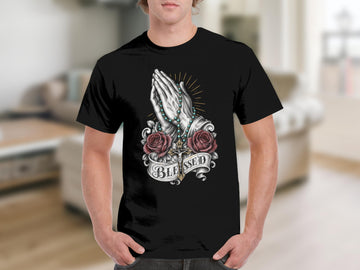 Black t-shirt with praying hands, rosary, roses, cross, and "BLESSED" text.