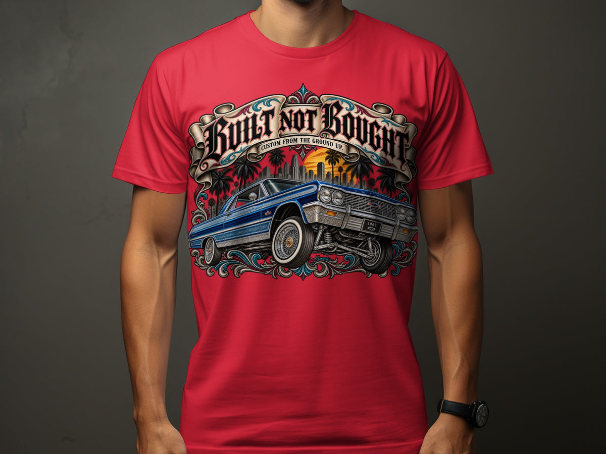 Red t-shirt with a lowrider car and "Built Not Bought" text design.