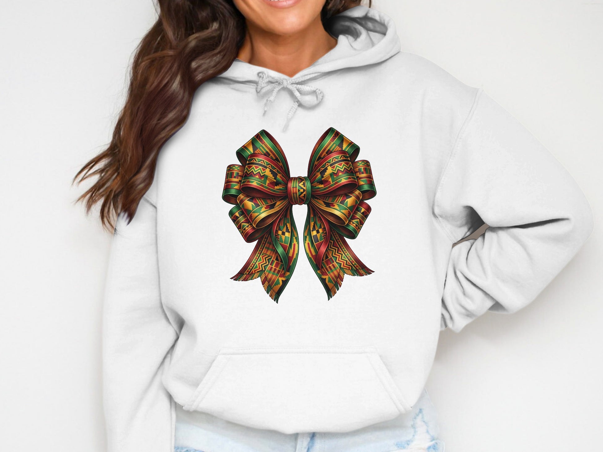 White hoodie with a colorful, patterned bow graphic.