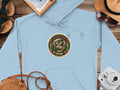 Light blue hoodie with a circular 