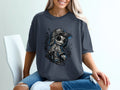 Charcoal t-shirt with graphic of a stylized skull wearing a baseball cap and backpack.