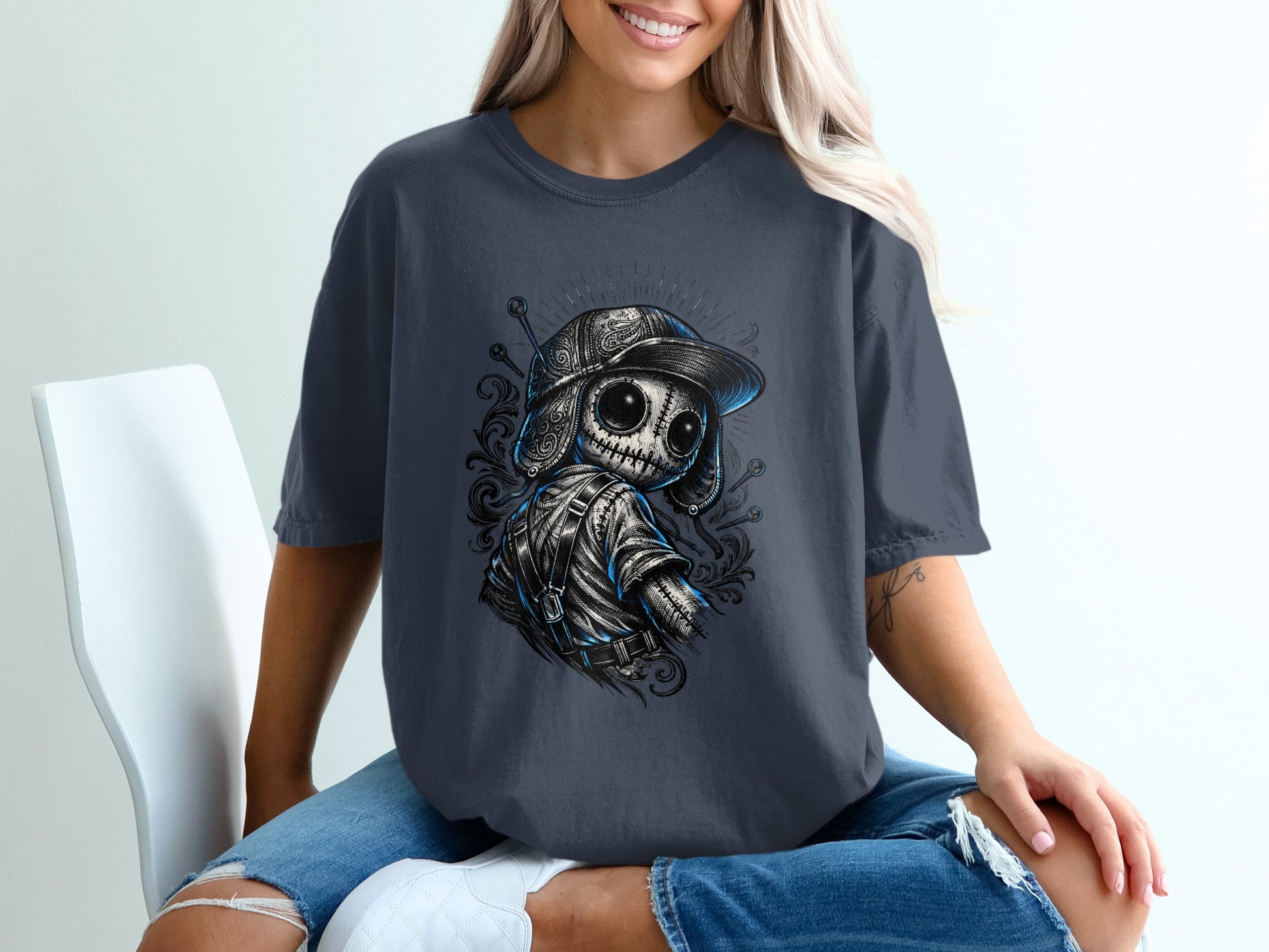 Charcoal t-shirt with graphic of a stylized skull wearing a baseball cap and backpack.