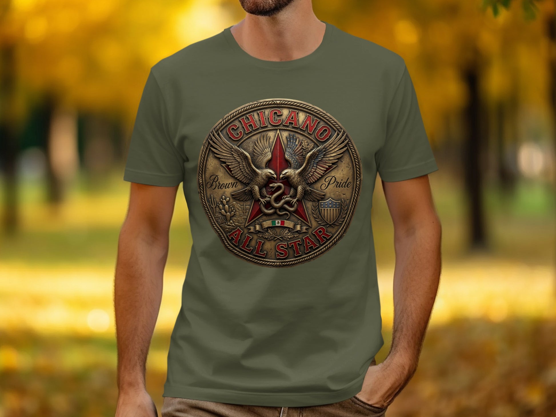 Olive green t-shirt featuring a circular emblem with eagles, a star, and "CHICANO" text.