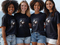 Four women wear t-shirts with a portrait of Jesus Christ.