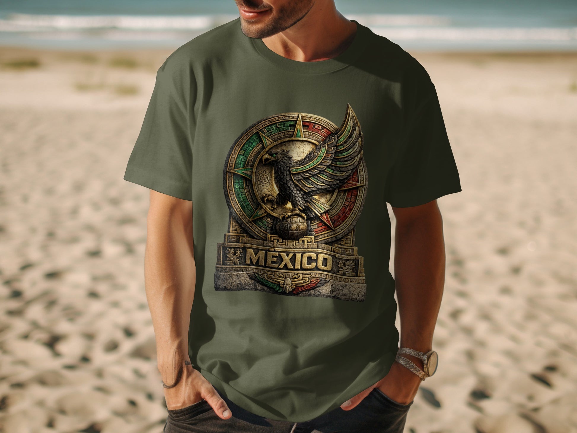 Man wearing olive green t-shirt with circular Mexico eagle emblem.