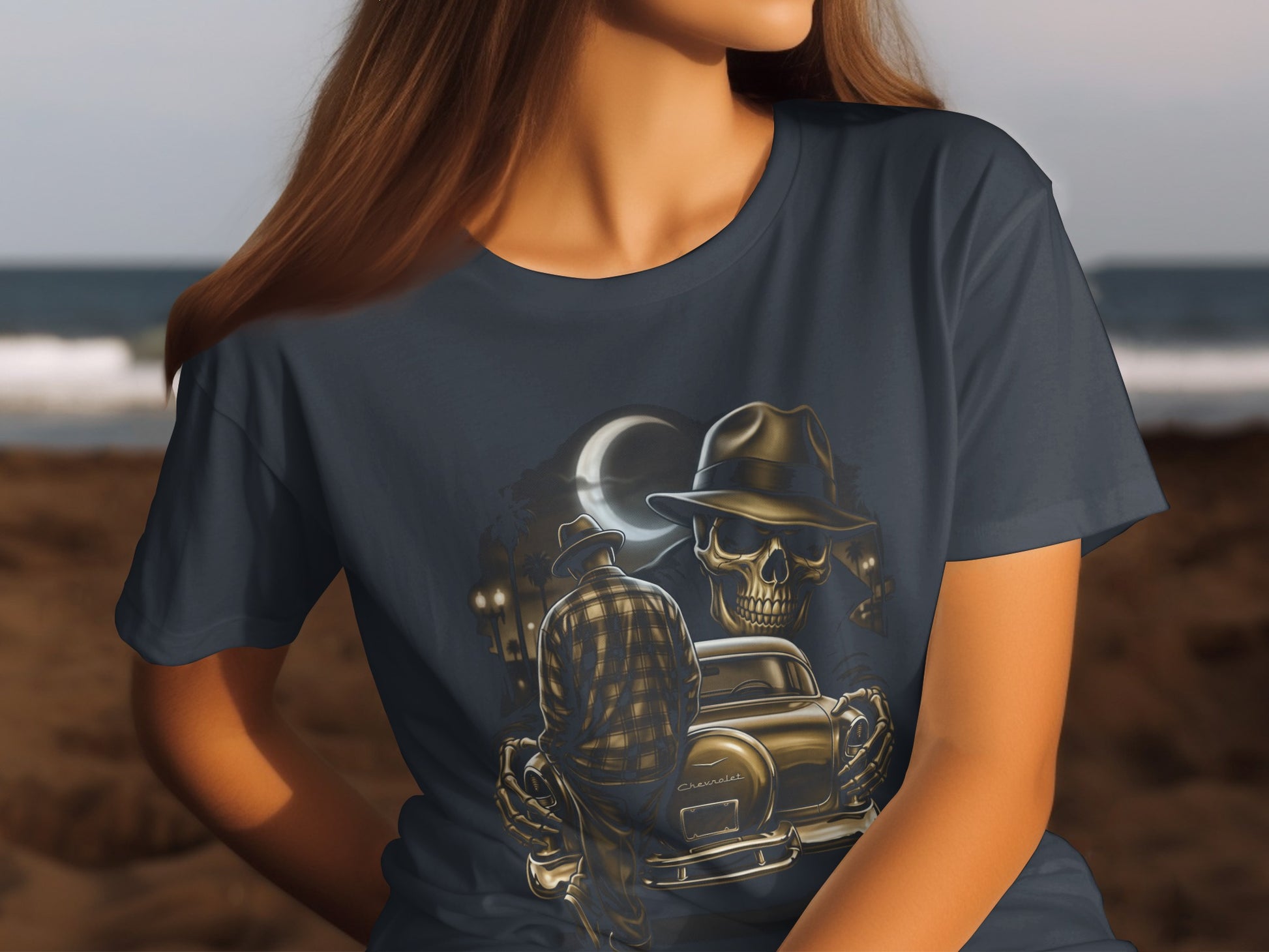 Dark t-shirt graphic features a skull, vintage car, and moonlit scene.