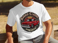 White t-shirt with a red classic pickup truck graphic that reads 