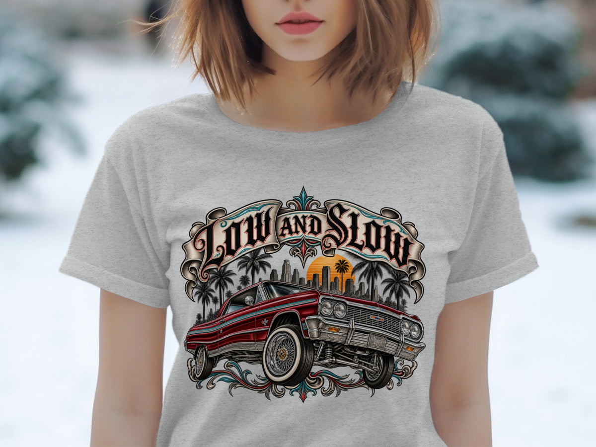 Red lowrider car with "LOW AND SLOW" text and palm trees.