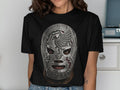 Black t-shirt with a silver lucha libre mask featuring an eagle and 