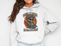 White hoodie with skull graphic and text 