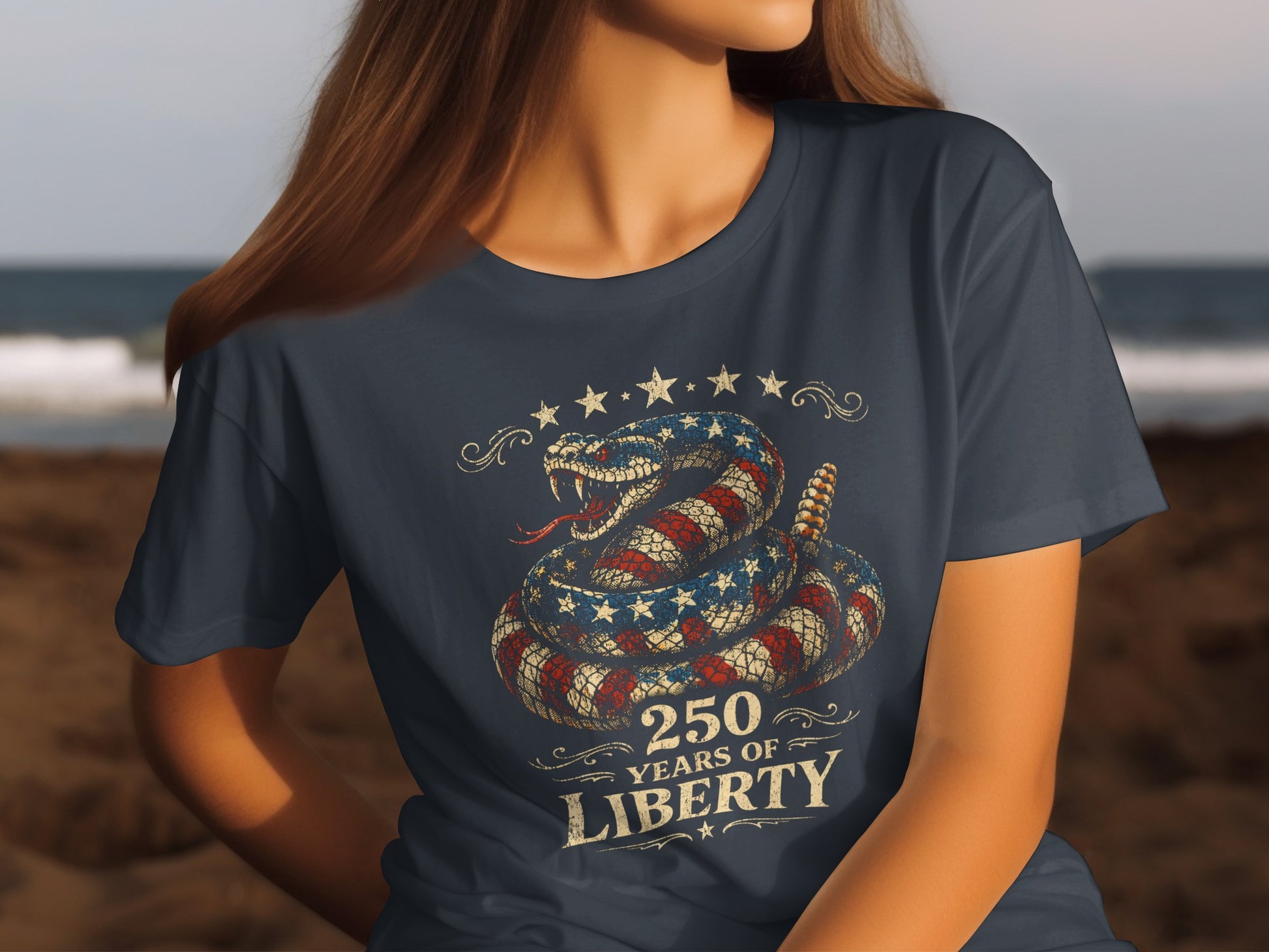 T-shirt featuring a coiled rattlesnake in a US flag pattern, stars, and "250 Years of Liberty."