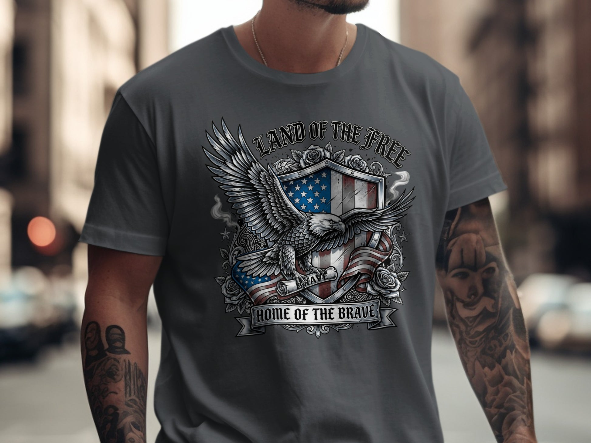 Gray t-shirt with an eagle and shield featuring American flag and text "Land of the Free, Home of the Brave".