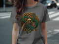 Green feathered serpent coiled around Aztec pyramid on grey t-shirt.